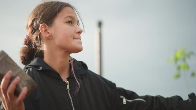 Teenager prepares to hurl object. Enthusiastic young person concentrates to launch item successfully. Determined adolescent readies with focus to throw object confidently and accurately