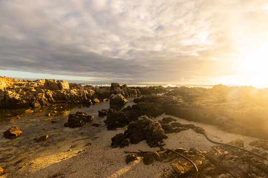 sunset light over DeKelders coastline, Gansbaai, South Africa