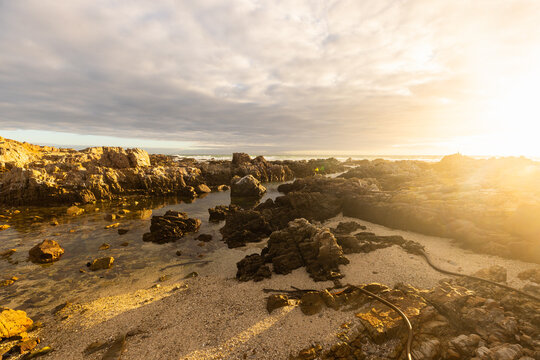 sunset light over DeKelders coastline, Gansbaai, South Africa