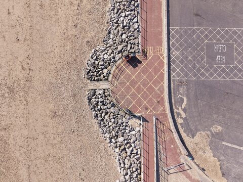 New Brighton Promenade curved seafront walkway with textured paving and expansive coastal scenery
