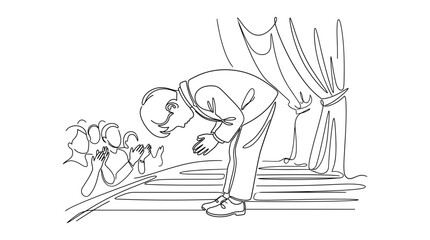 Obraz premium A man bowing on stage after a performance.