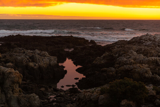 sunset light over DeKelders coastline, Gansbaai, South Africa