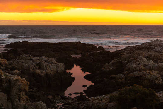 sunset light over DeKelders coastline, Gansbaai, South Africa