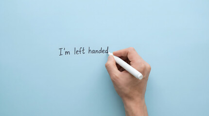 hand writing i'm left handed on blue background