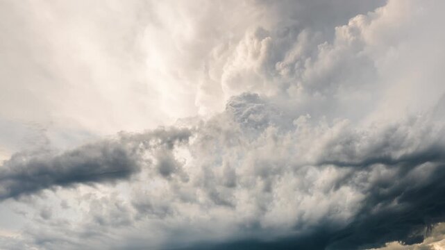 Dark thunderclouds rolling through sky in dramatic storm scene background