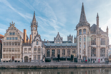 Obraz premium Historic canal cityscape in Ghent Belgium on a sunny day