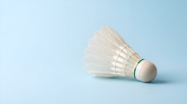 Badminton Shuttlecock on a light blue background, close-up studio shot