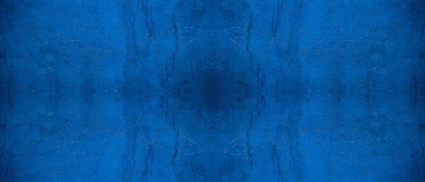 Vibrant blue painted wall featuring a textured surface with a symmetrical and distressed artistic pattern design