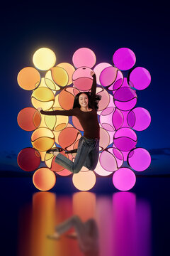 3D pink sphere wall with jumping woman and reflection