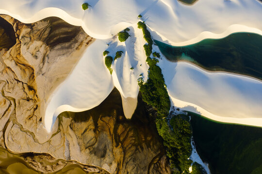 Aerial view of Parque Nacional dos Lencois Maranhenses with white sand dunes, turquoise lagoons, and green vegetation Lencois Maranhenses, MA, Brazil.