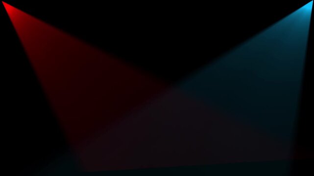 Dynamic stage lighting with red and blue spotlights creating atmospheric effects on dark background.