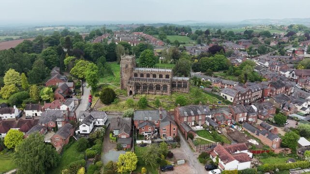 The stunning St Oswald&rsquo;s Church and surrounding Malpas village - drone rotate from far, then move in, Cheshire, UK