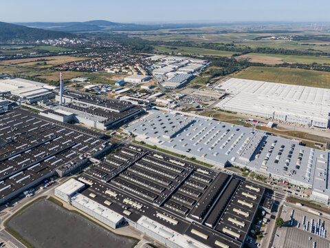 Aerial view of the Volkswagen plant near Devinska Nova Ves featuring vast industrial buildings and surrounding green landscape in Bratislava, Bratislavsky kraj, Slovakia.