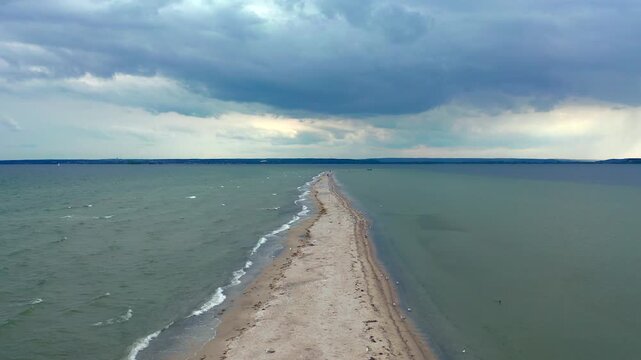 Scenic overview of Mewia Rewa sandbank dividing Puck Lagoon into inner and outer sections. Crystal clear Baltic waters surround this unique formation.