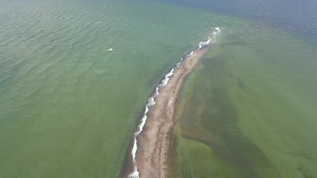 Vertical aerial shot of Mewia Rewa sandbar patterns. Bird's-eye perspective reveals intricate details of this formation's textures and crystal water.