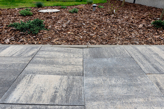 Sunken paving slabs on a damaged backyard driveway