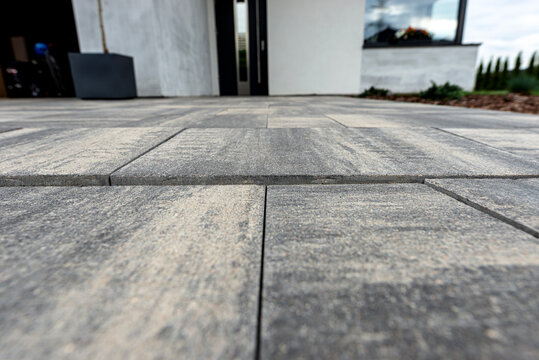 Sunken paving slabs on residential driveway showing subsidence