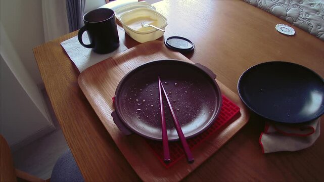 Peaceful breakfast with cool breeze and morning sunlight, calm at home lifestyle scene for relaxing daily living use