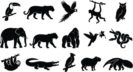 Obraz premium Black silhouettes of various wild animals and birds on white background, including toucan, tiger, eagle, monkey