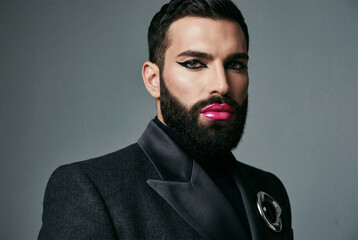 Obraz premium Fashion Bearded Man Pink Lipstick Eyeliner Gender Fluid Editorial Portrait