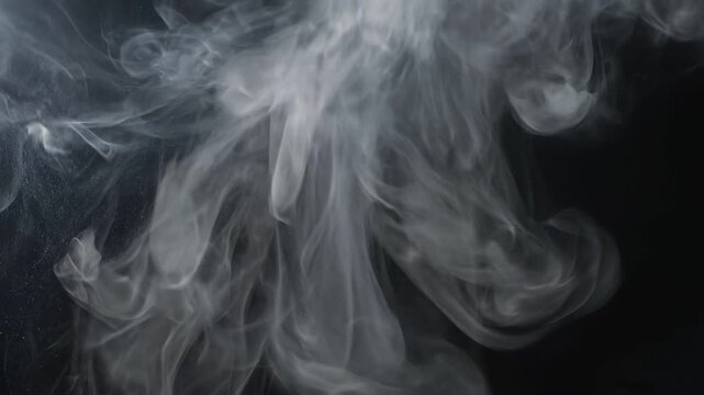Abstract smoke forming ethereal shapes against a dark background, creating a mystical and calming atmosphere