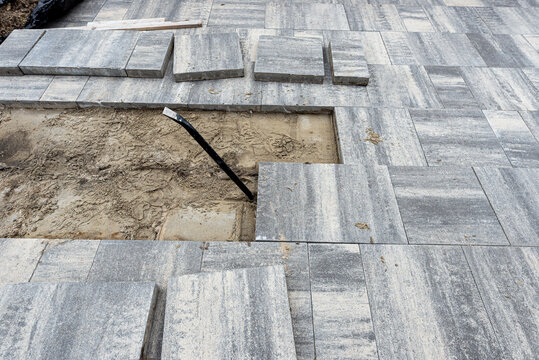 Removing paving stones for driveway repair and renovation