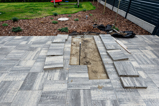Removing paving slabs for driveway repair