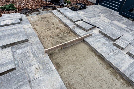 Paving work laying concrete slab patio renovation