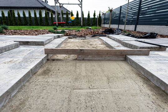 Paving work in progress creating a driveway path