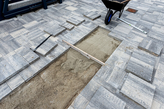 Paving slabs installation work on backyard patio