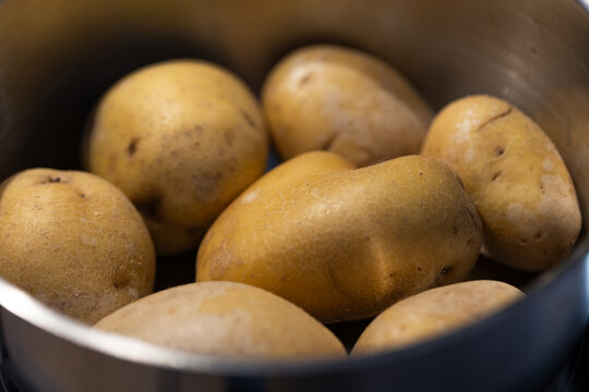 Close-up raw potatoes in a pot, vegatable, food. Vegetarian food, cooking, healthy eating, preparing meals, lunch.