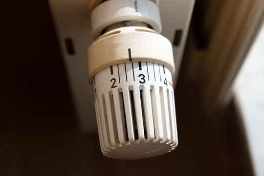 Close-up of a heating valve for regulating room temperature. Technical equipment, gas or oil heating, warmth in winter when it's cold, no freezing, creating a cozy atmosphere.