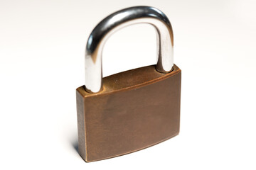 Naklejka premium Close-up locked padlock. Safe, security equipment, privacy, metal. White background.