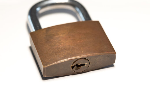 Close-up locked padlock. Safe, security equipment, privacy, metal. White background.