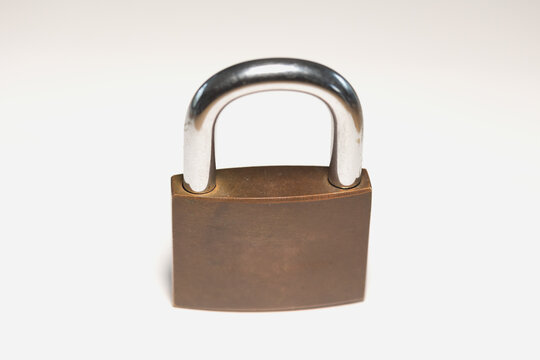Close-up locked padlock. Safe, security equipment, privacy, metal. White background.