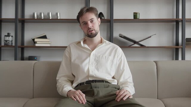 Surprised Man Reacting To Shocking News During Online Video Call At Home