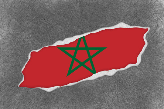 Textured Dark Grey Surface Torn to Reveal the Vibrant Red Flag of Morocco with Its Green Pentagram Symbol