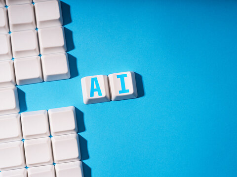 Artificial intelligence concept, keycaps on blue background.