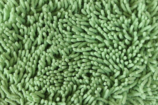 Green Chenille Microfiber Texture Background Close-Up