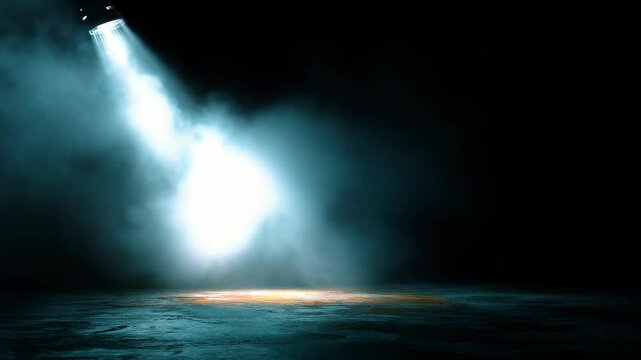 Spotlight shining through swirling smoke in dark room