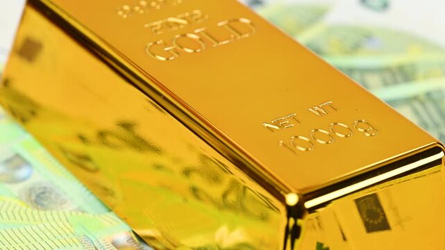 gold bars with euro bills