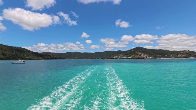 Airlie Beach Australia water landscape view with boat wake