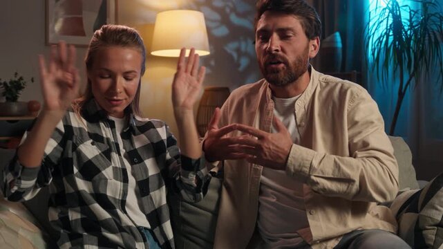 Caucasian middle-aged couple arguing conflict angry quarrel family problem divorce spouses husband with wife argue rage talking woman with man misunderstanding trouble talk furious at evening home