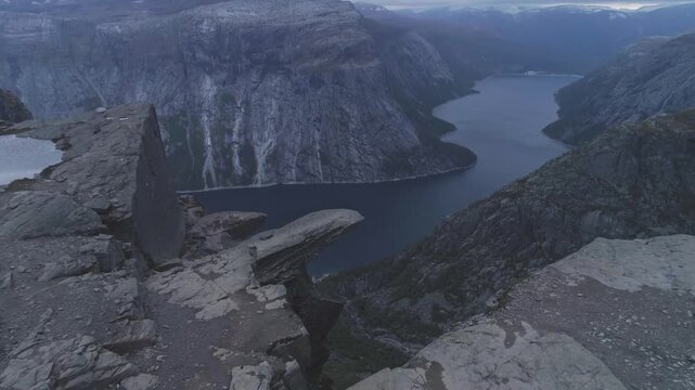 Dramatic Aerial View of Trolltunga Rock Tongue Overlooking Fjord and Mountains