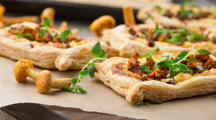 Tarts of puff pastry with mushrooms © Iuliia Metkalova