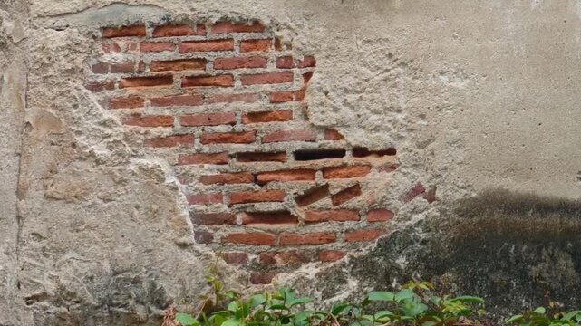 Damaged wall structure, old red bricks.
