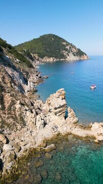 Spiaggia di Sansone Beach, Elba Island Italy &ndash; Forward Drone Flight Toward La Porta degli Angeli Rock Arch and Coastline