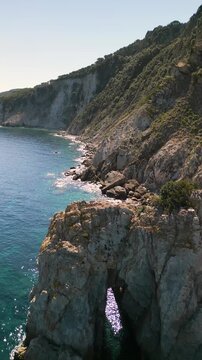 Spiaggia di Sansone Beach, Elba Island Italy &ndash; Forward Drone Flight Toward La Porta degli Angeli Rock Arch and Coastline