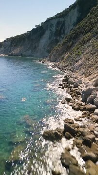 Spiaggia di Sansone Beach, Elba Island Italy &ndash; Flying Drone Shot Over Crystal Clear Water Along the Shoreline