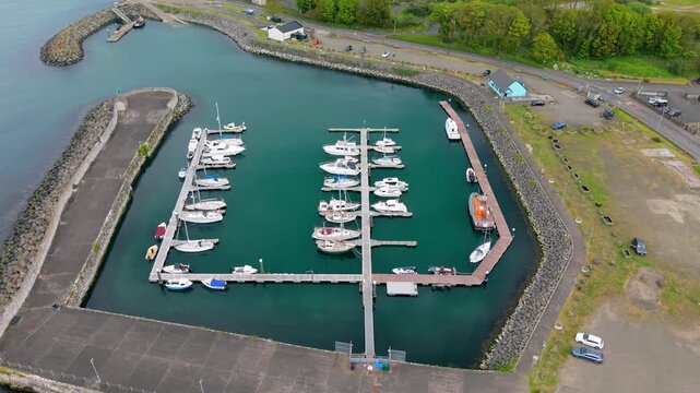 Overhead rotating 4K 60FPS aerial video of Glenarm in County Antrim, Northern Ireland in the UK. Produced in 3840x2160 and with Rec709 color.